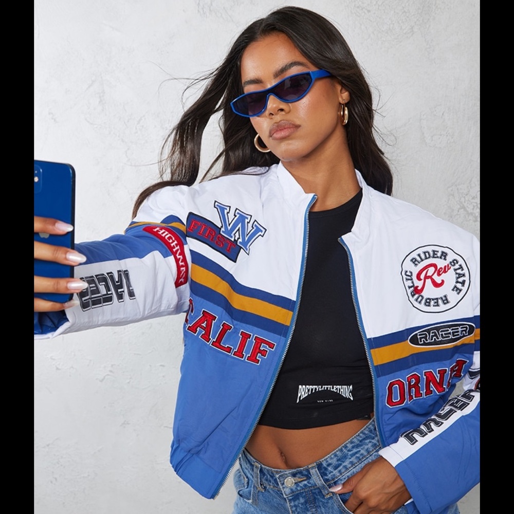 PrettyLittleThing Blue oversized graphic zipped racer bomber jacket